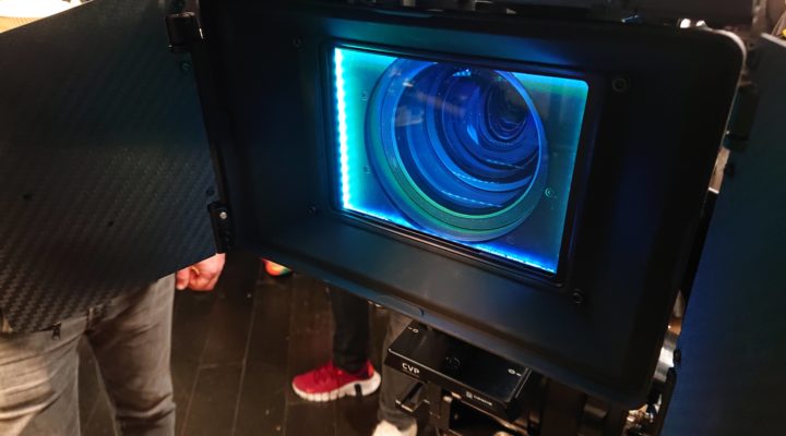 Diffusion filter in a mattebox glowing with blue-green light