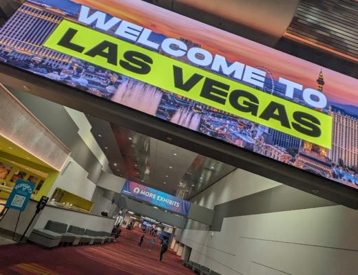 A large sign reading "welcome to Las Vegas" in the central hall lobby of the Las Vegas Convention Center.