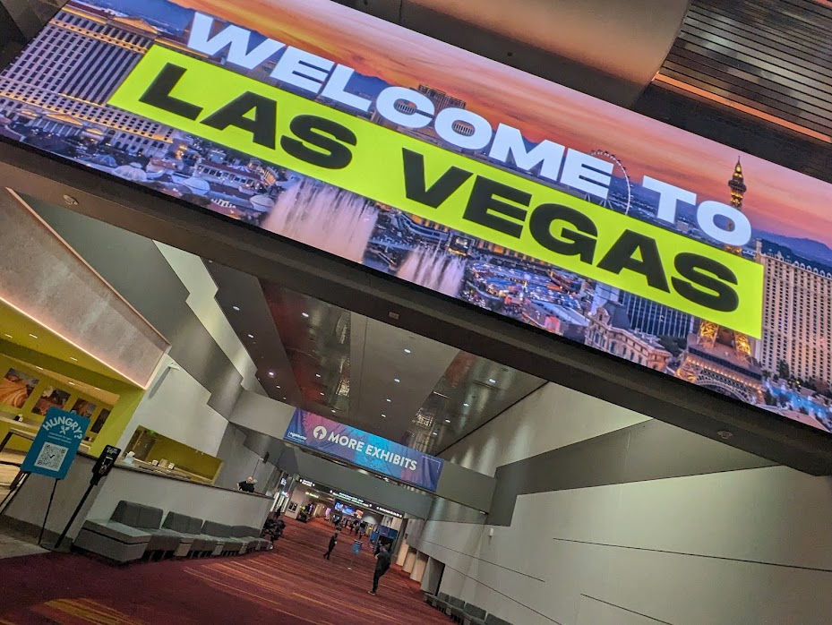 A large sign reading "welcome to Las Vegas" in the central hall lobby of the Las Vegas Convention Center.