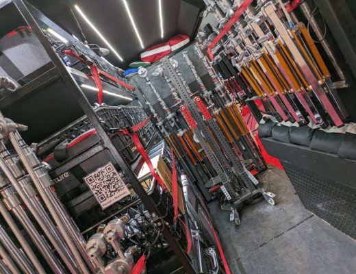 Interior of a grip van full of lighting stands.