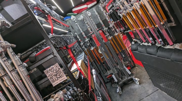 Interior of a grip van full of lighting stands.