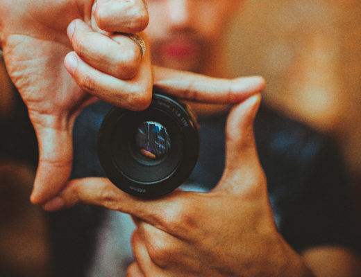 A photographer marking a frame with his fingers